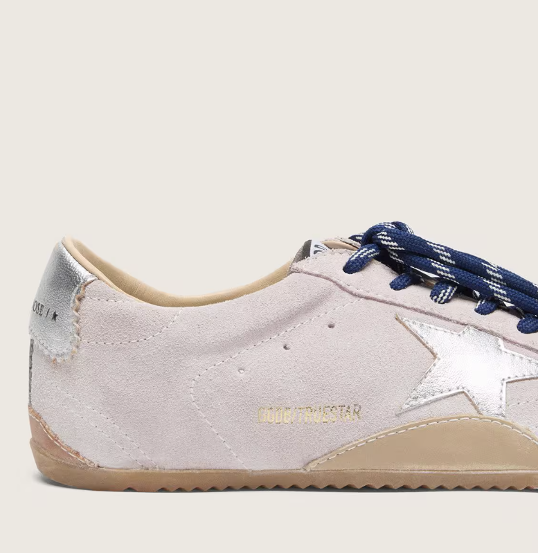 True in pastel pink suede with a star and silver heel tab