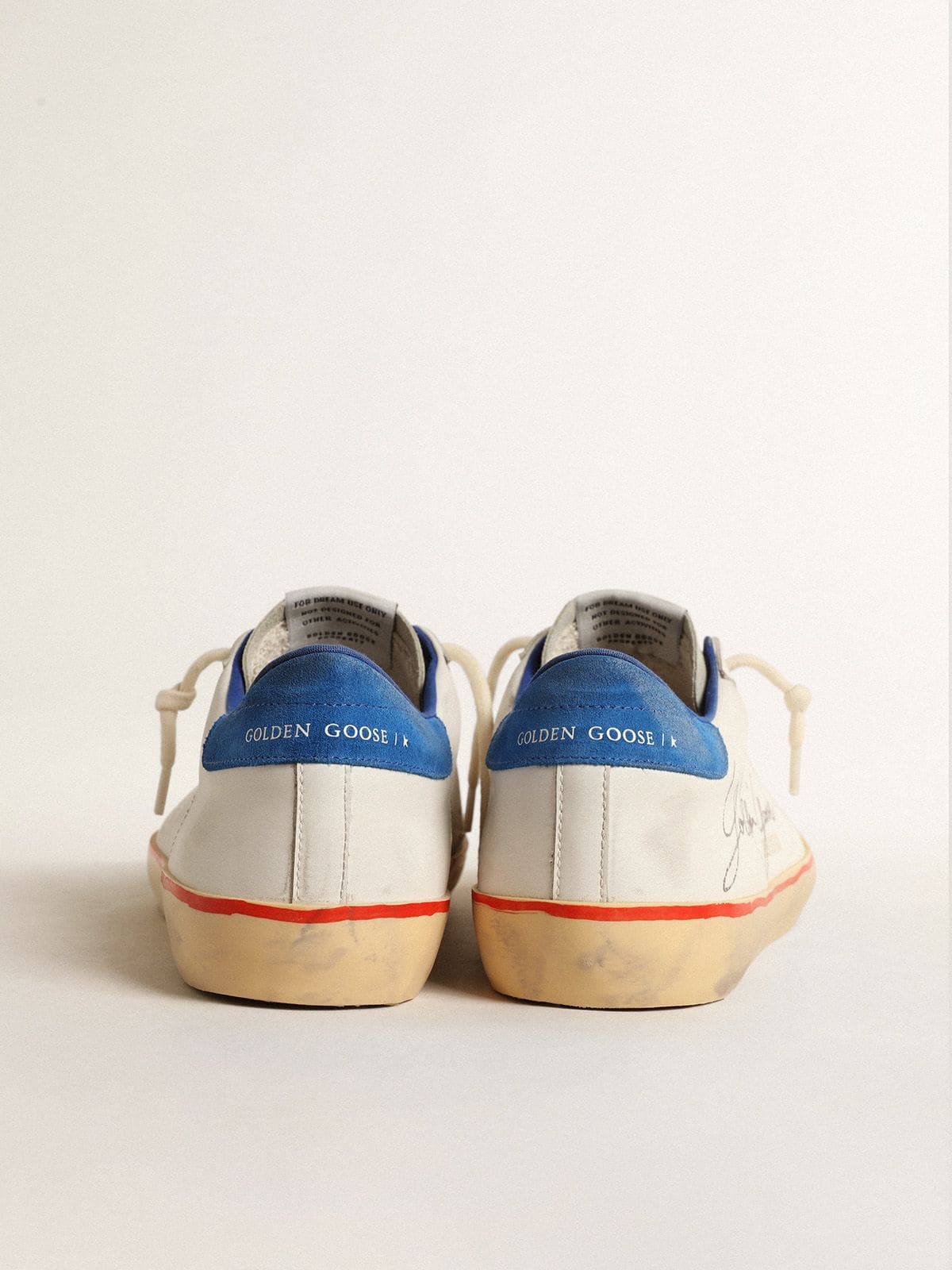 Pierced star and blue suede heel tab