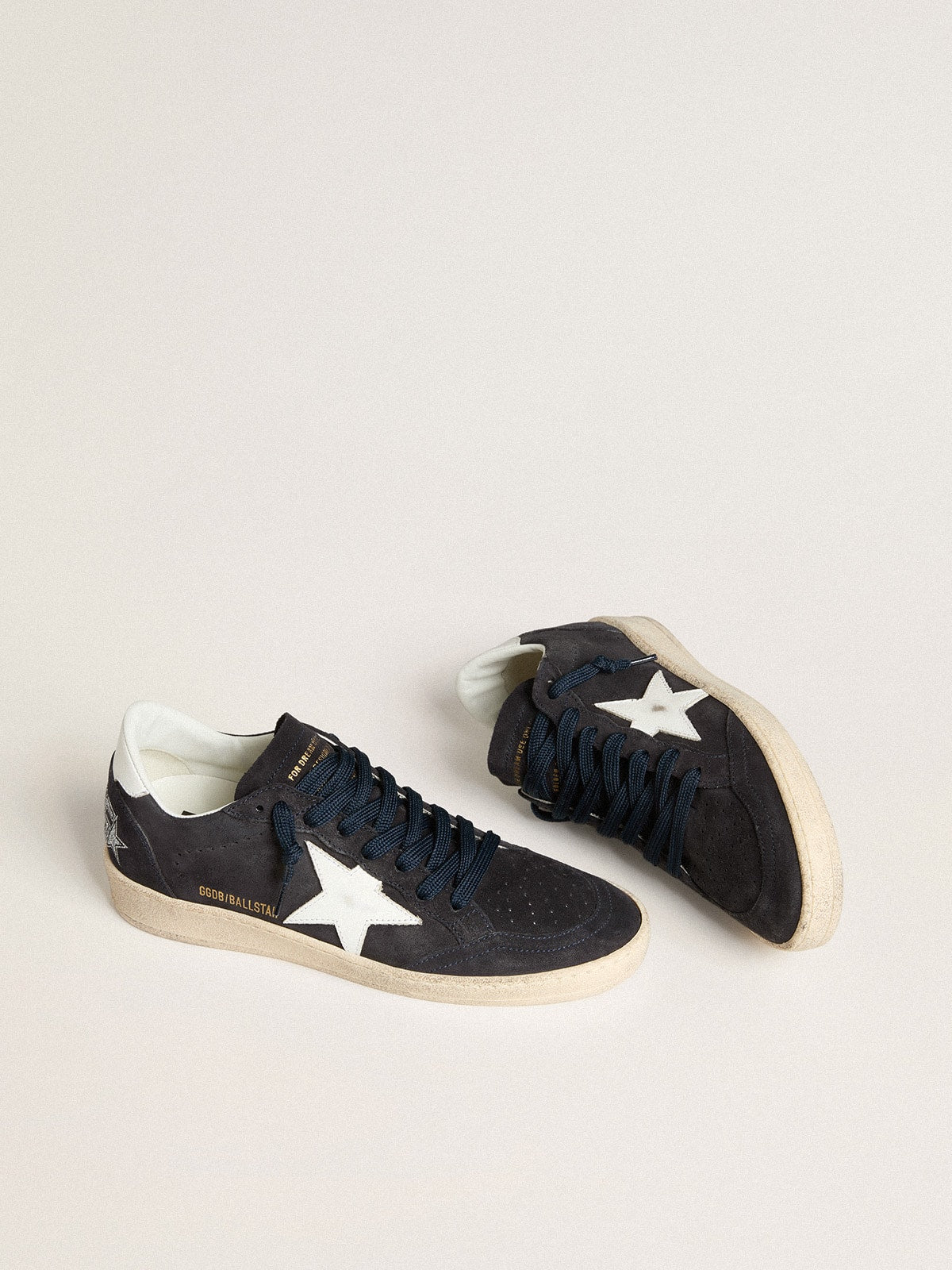 Dark blue suede with a star and a leather heel tab