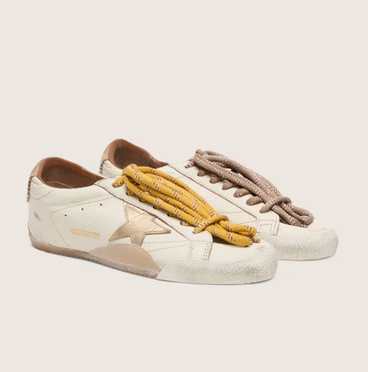White nappa leather with a gold star and a beige suede heel tab
