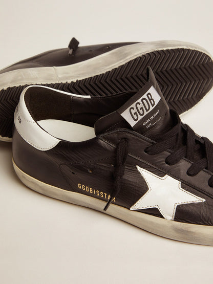 Black leather with a star and a white leather heel tab