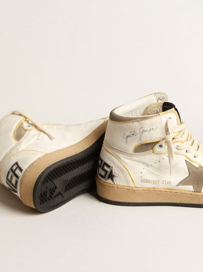 White nappa leather with a tortoise color suede star