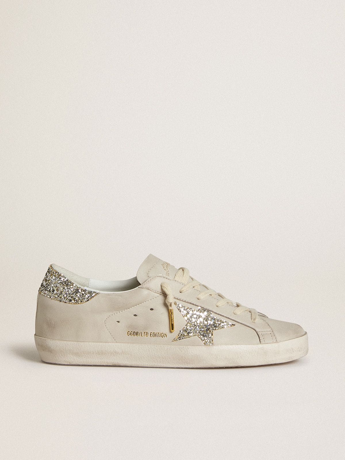 LTD in ivory nappa leather with a star and a platinum glitter heel tab
