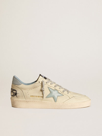 LTD with a light blue plastic star and a leather tab on the back