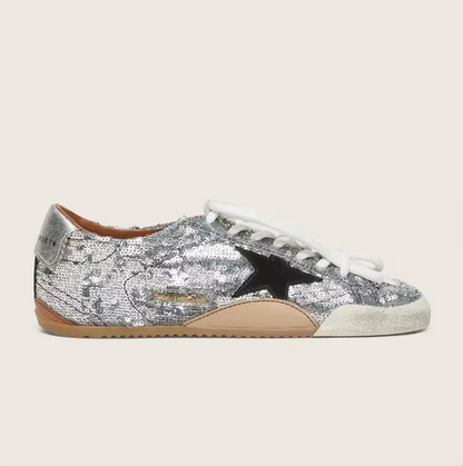 True in silver sequins with a black star and a silver leather heel tab