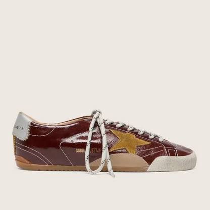 True in burgundy nappa leather with a suede star and a silver nappa leather heel tab