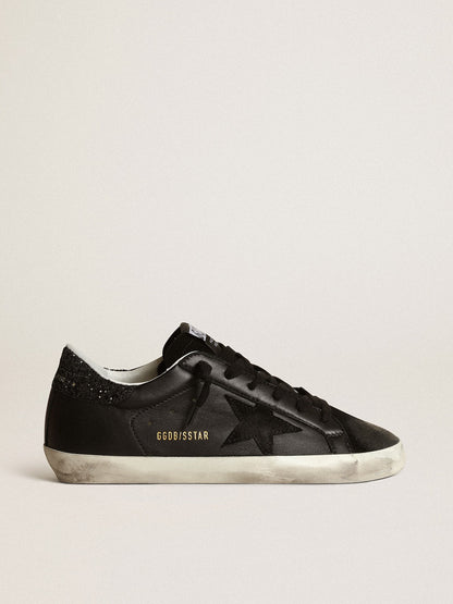 Black nappa leather with a black suede star and a black glitter heel