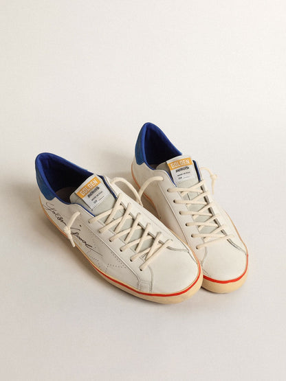 Pierced star and blue suede heel tab