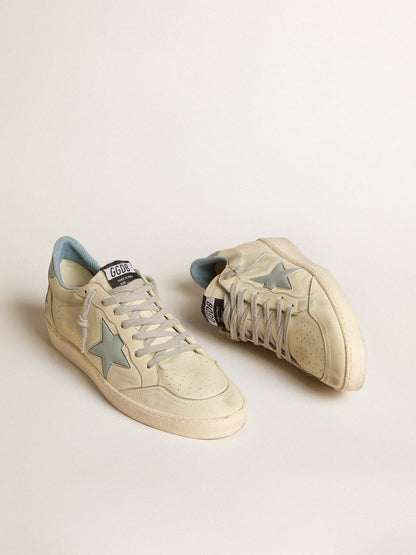 LTD with a light blue plastic star and a leather tab on the back