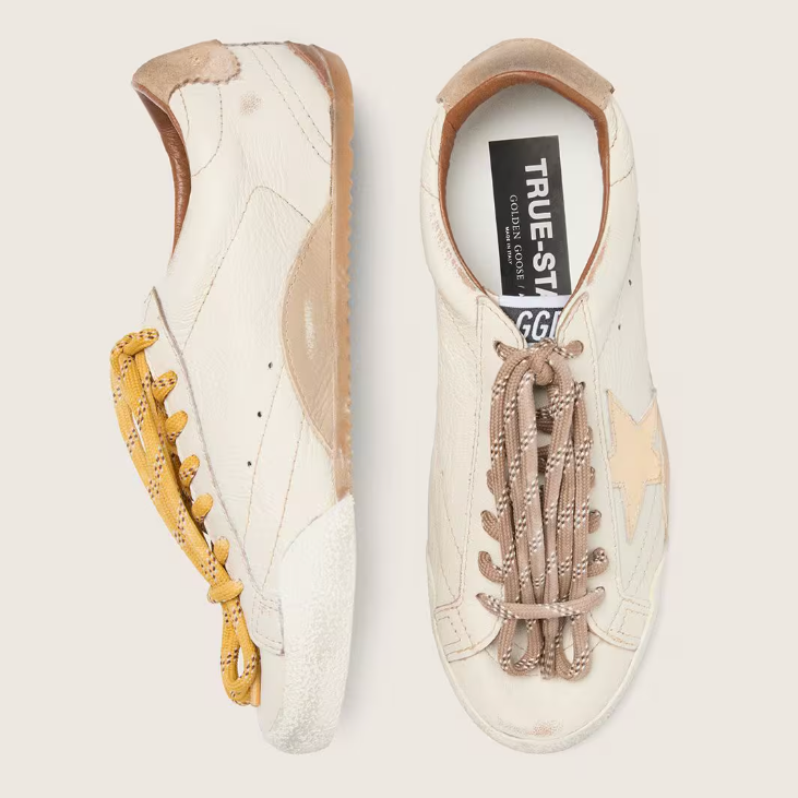 White nappa leather with a gold star and a beige suede heel tab