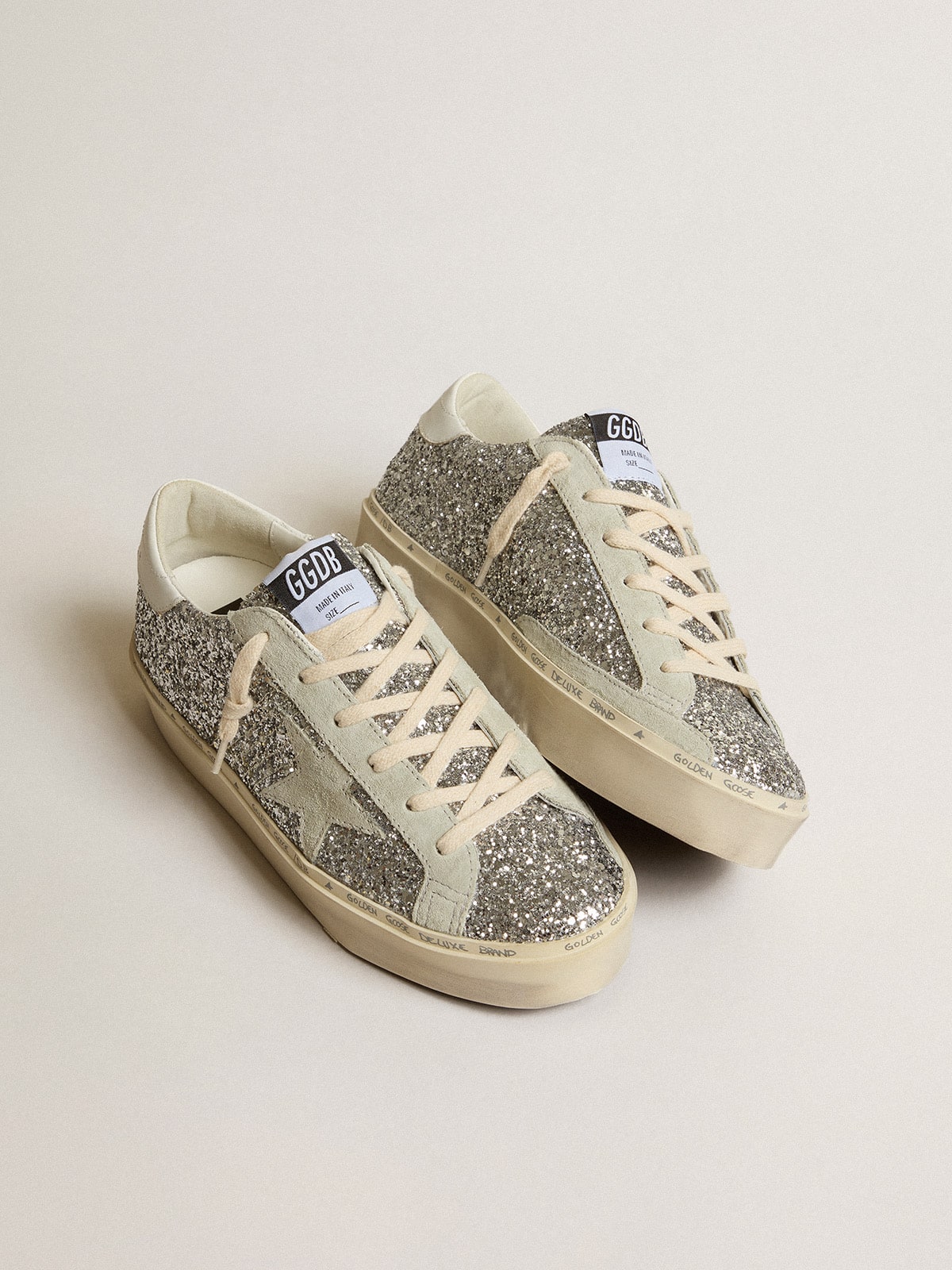 Silver glitter with a suede star and a white heel tab