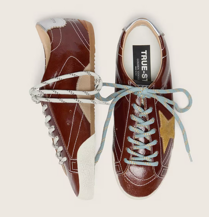 True in burgundy nappa leather with a suede star and a silver nappa leather heel tab