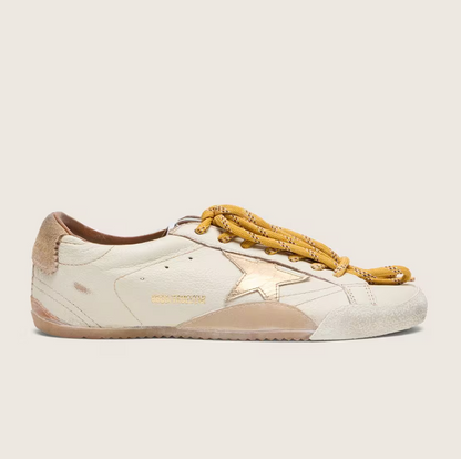White nappa leather with a gold star and a beige suede heel tab