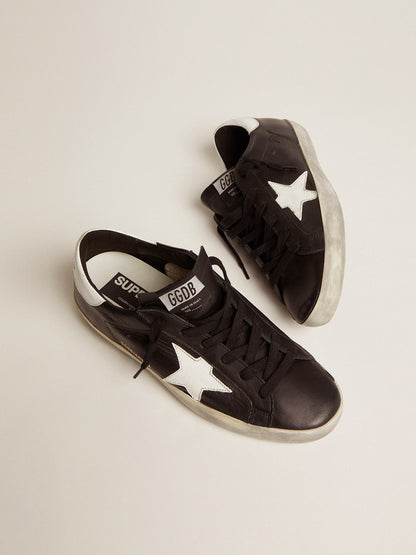 Black leather with a star and a white leather heel tab