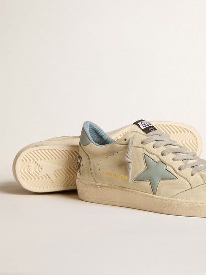 LTD with a light blue plastic star and a leather tab on the back