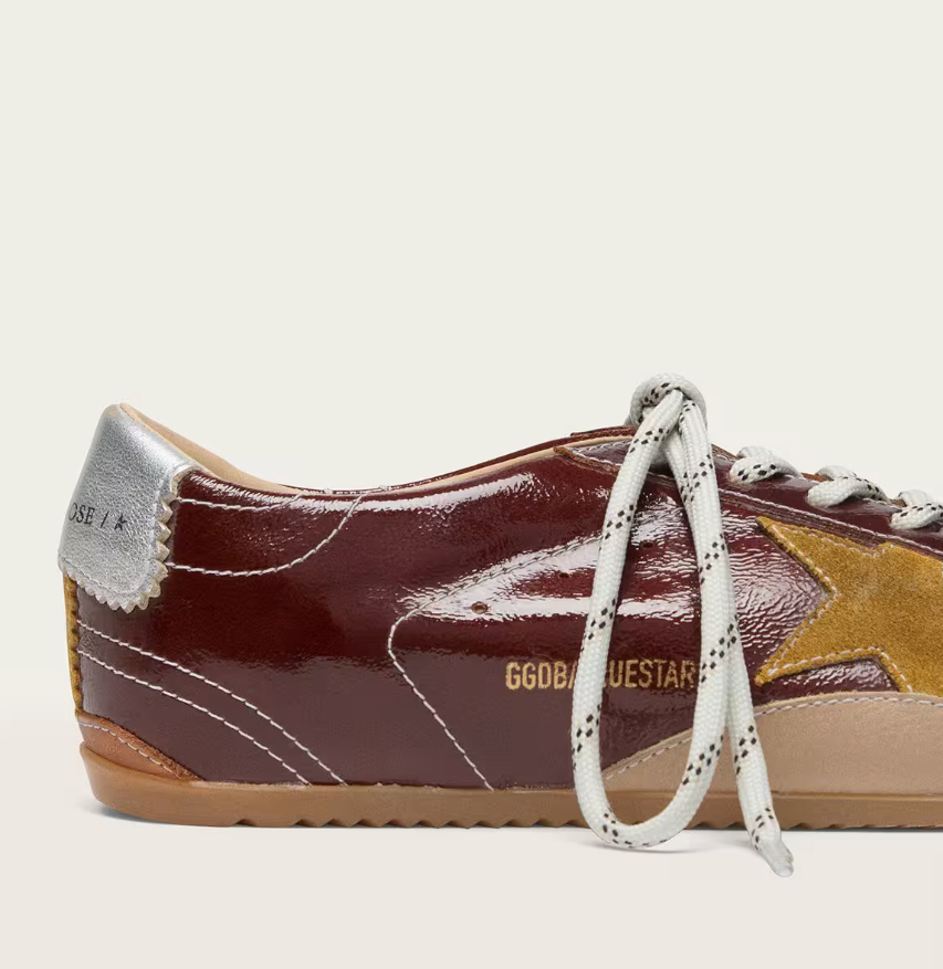 True in burgundy nappa leather with a suede star and a silver nappa leather heel tab