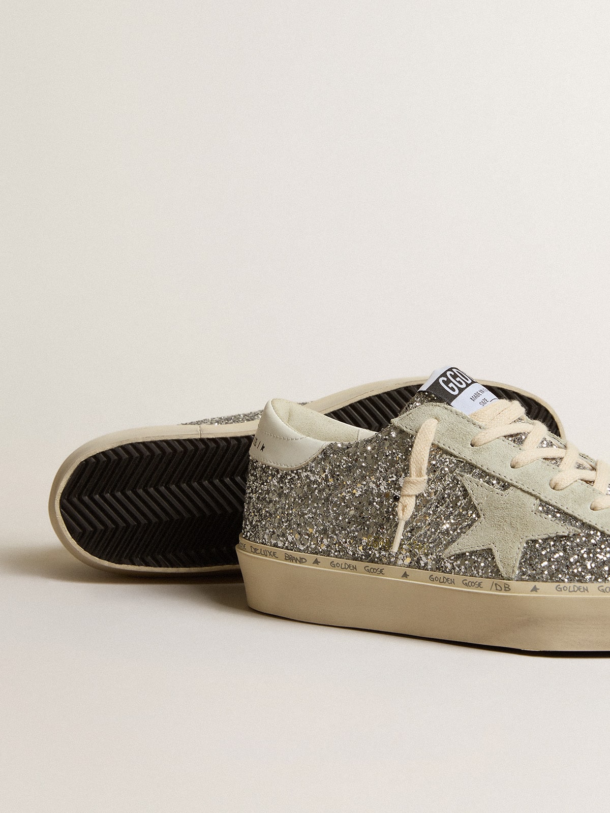 Silver glitter with a suede star and a white heel tab