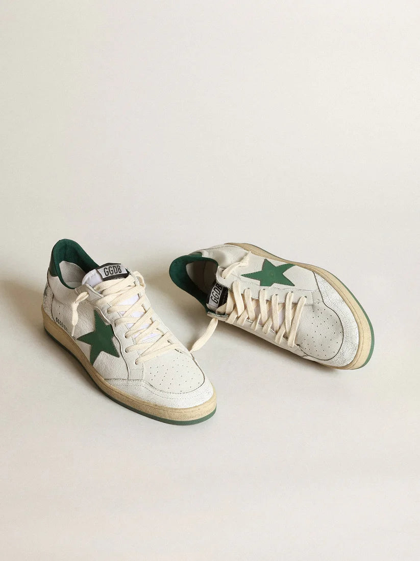 White nappa leather with a star and a green leather heel tab