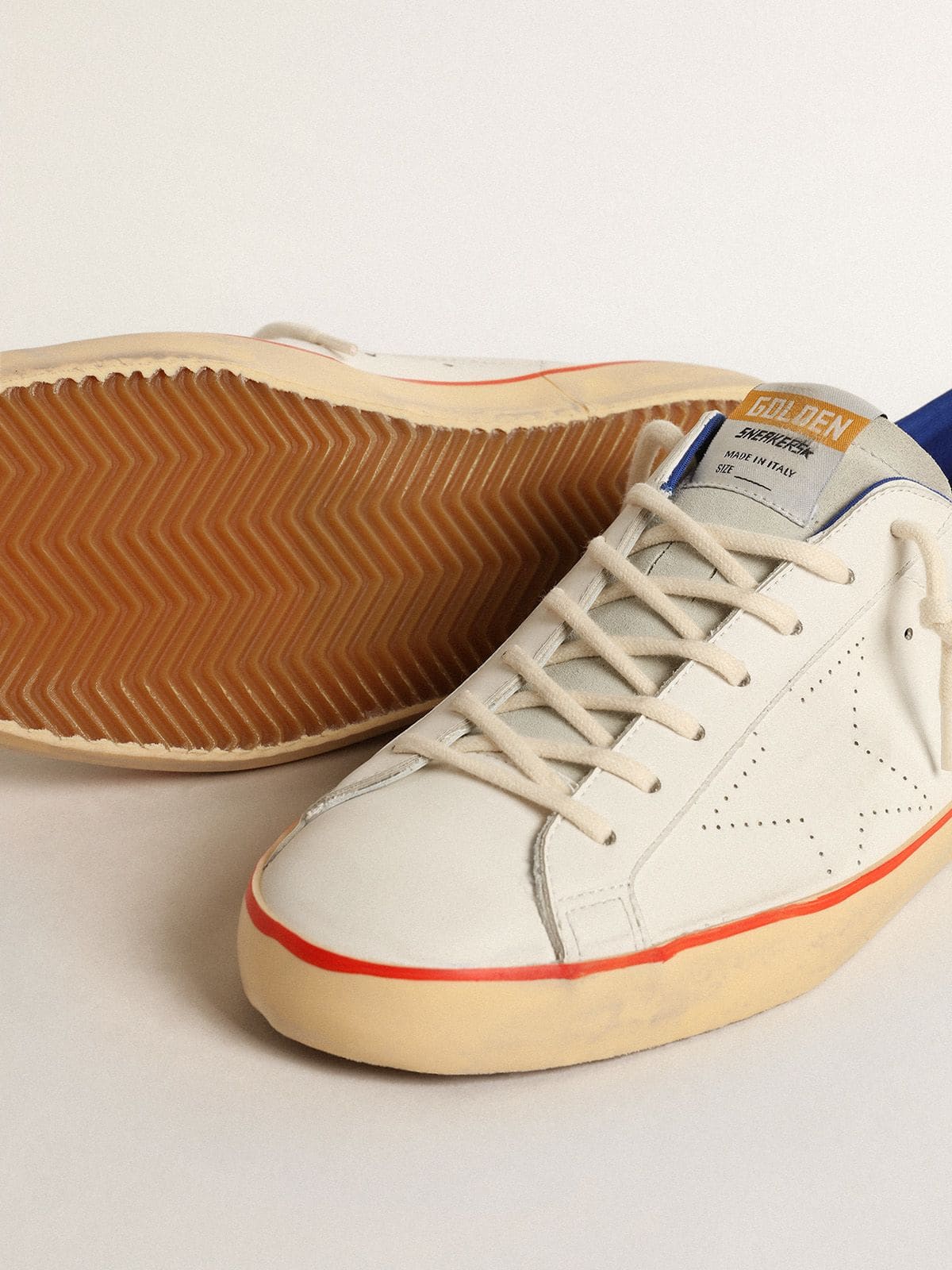 Pierced star and blue suede heel tab