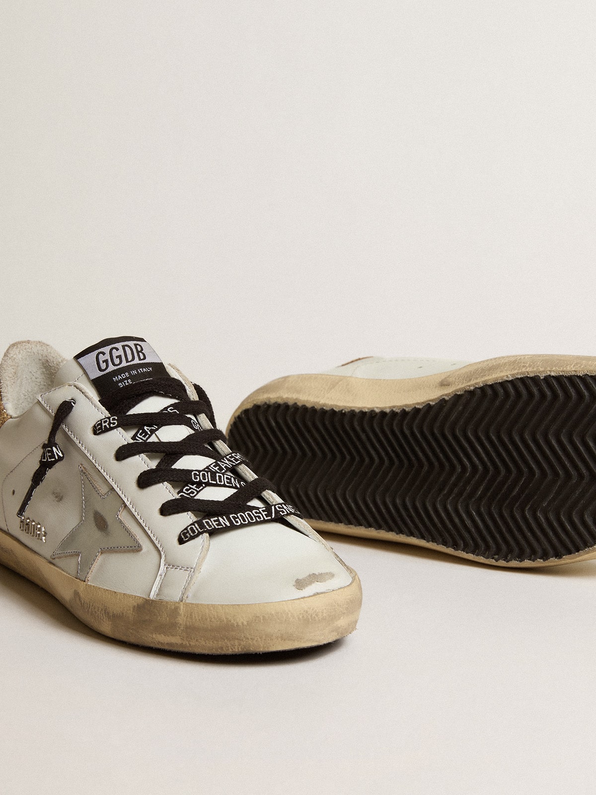 White leather shoes with a glitter heel
