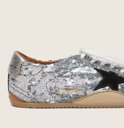 True in silver sequins with a black star and a silver leather heel tab