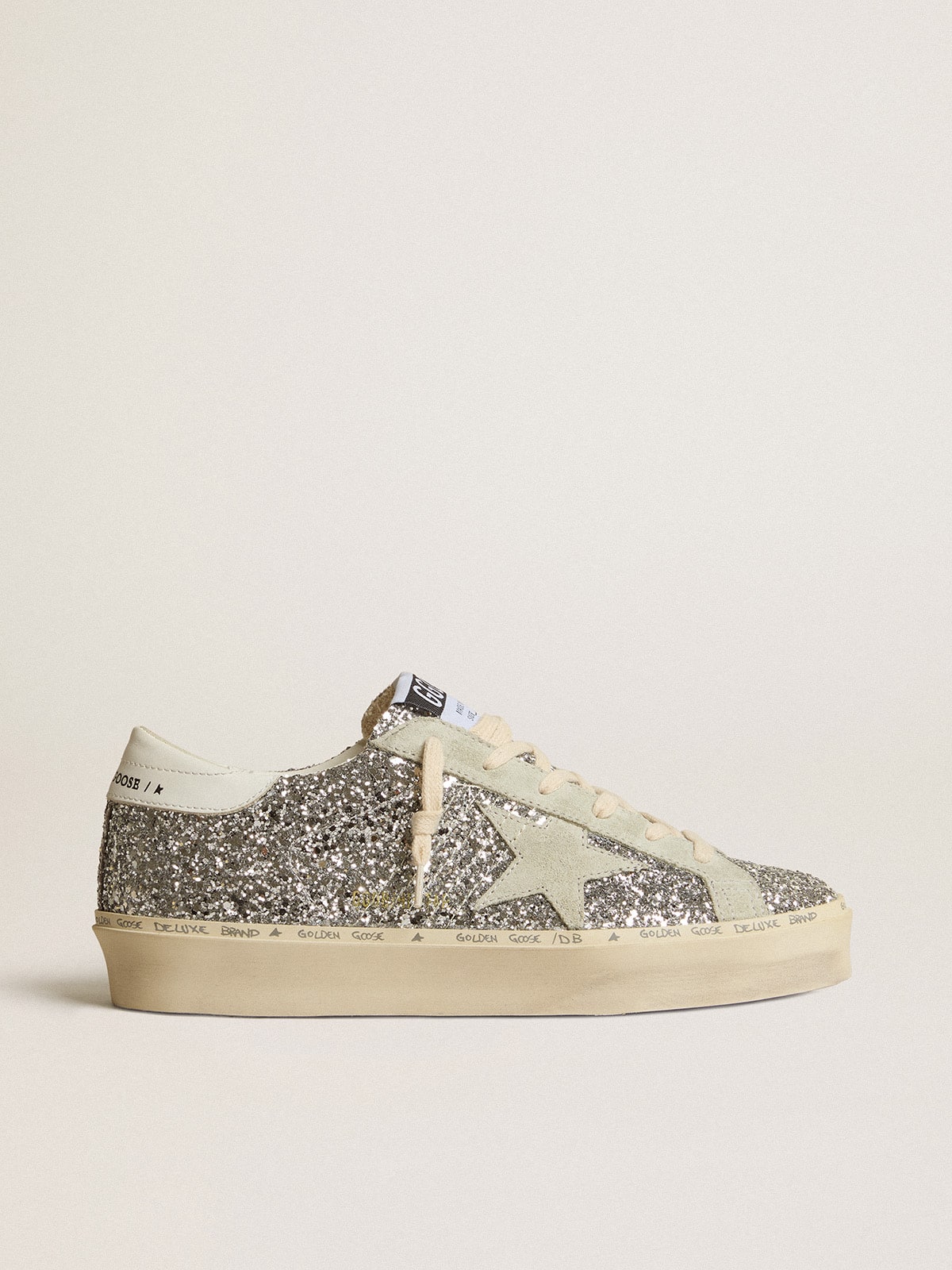 Silver glitter with a suede star and a white heel tab