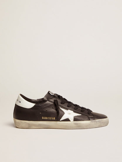Black leather with a star and a white leather heel tab