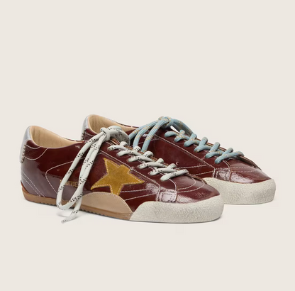 True in burgundy nappa leather with a suede star and a silver nappa leather heel tab