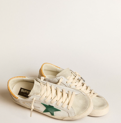Green suede star and yellow crocodile-effect heel